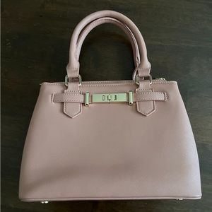Miztique purse peachy pink with long strap that can detach.